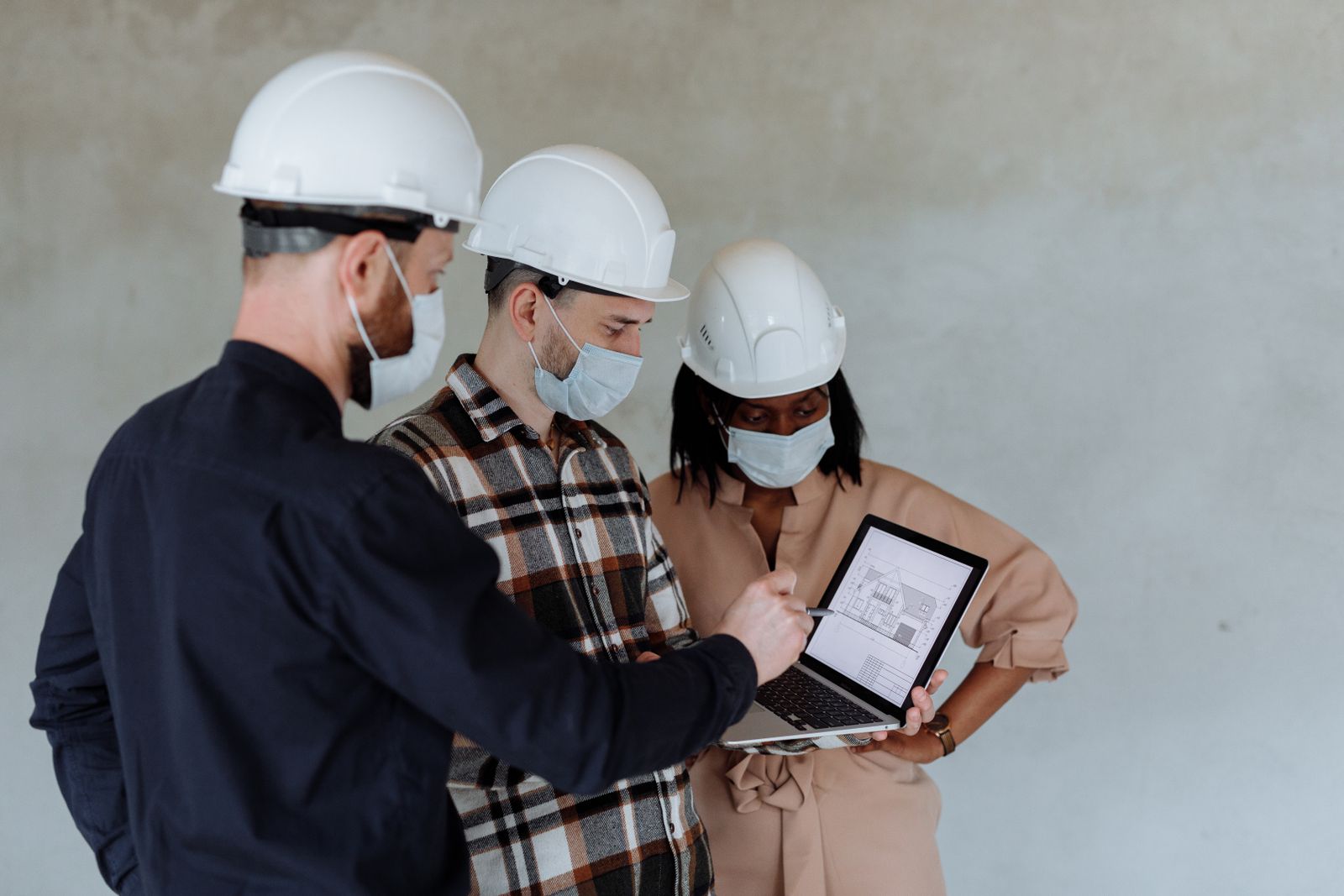 Engineers reviewing a digital plan